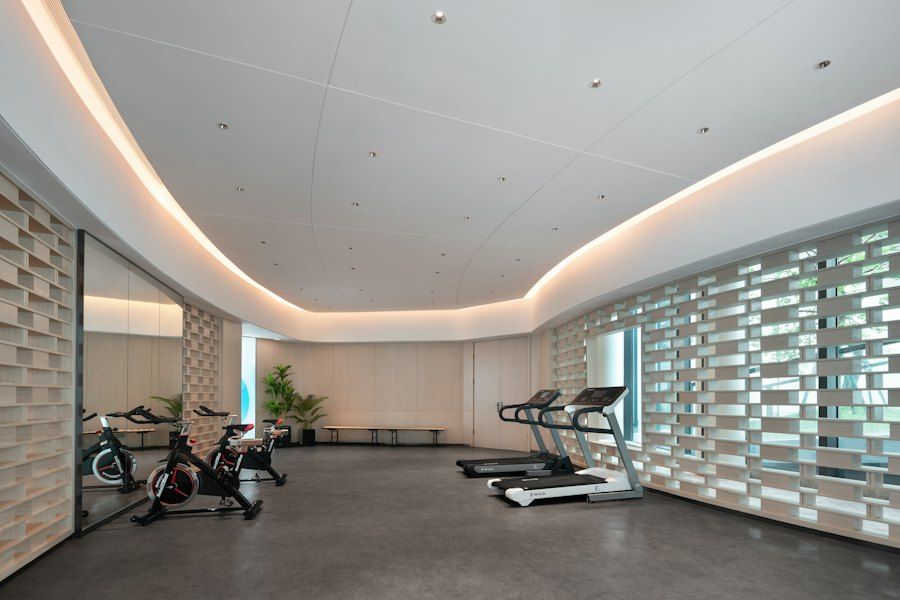 A modern gym with treadmills and bikes